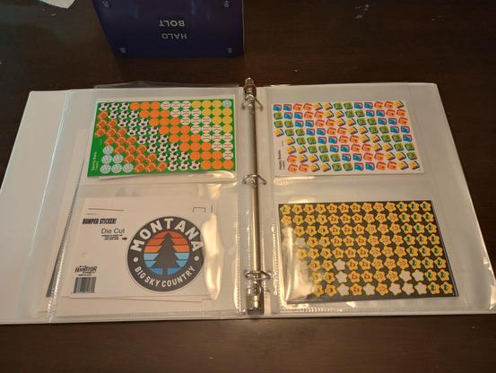 pages of stickers: footballs, books, stars, and a montana bumper sticker