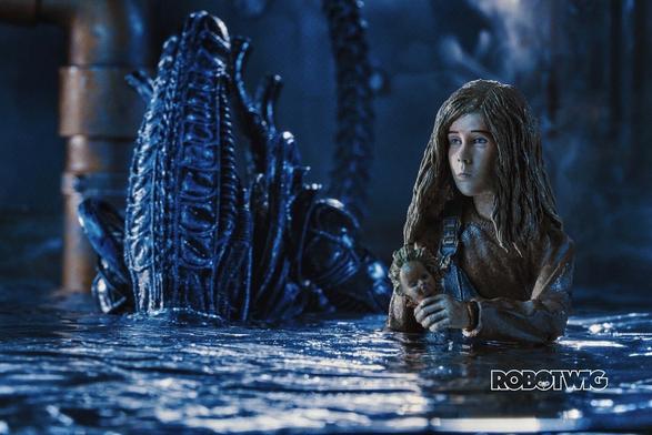 Newt in the water an Alien is emerging from behind her