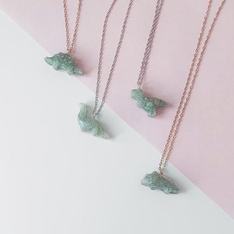small necklace with green dinosaur charm made out of recycled plastics