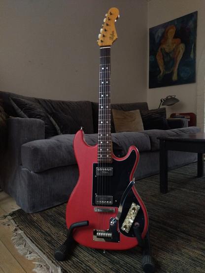 Full view of the instrument on a stand in front of my sofa