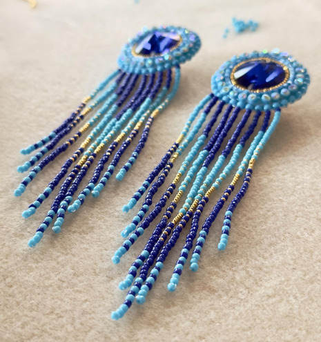 The same pair of earrings on bead mat