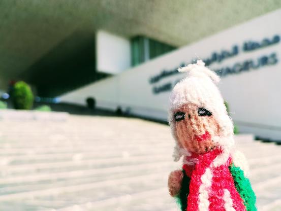 Finger puppet on tenterhooks at the bottom of the steps to Casa Voyageurs train station.