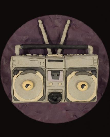 cartoon claymation boombox on a purple background