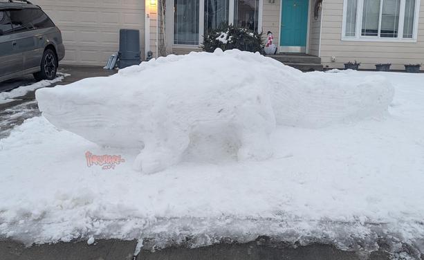 Photo from side of an ankylosaurus snow sculpture