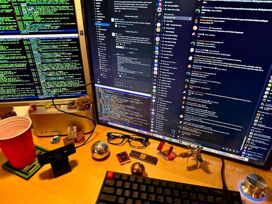 photo of a dual-LCD-display Mac setup on a desk - close up