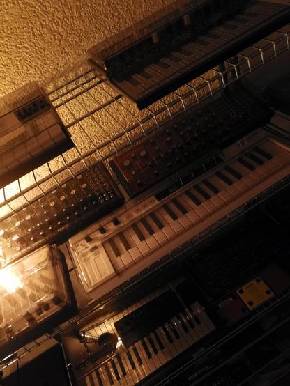 Synths on shelves: MicroFreak, minilogue XD, DFAM, Neutron, Analog Heat MkII, Lemondrop, Razzmatazz, JD-08.