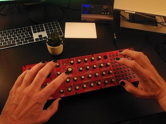 My hands with black nail varnish greedily grabbing a Neutron.