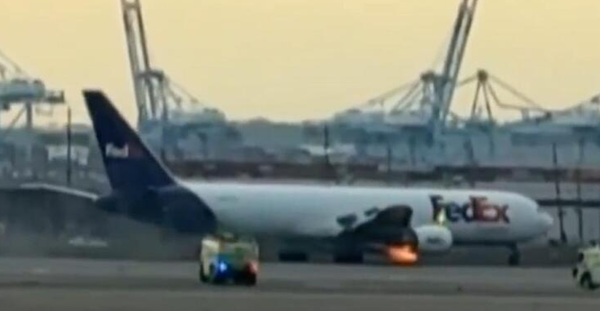 FedEx plane with an engine burning due to sucking in a bird