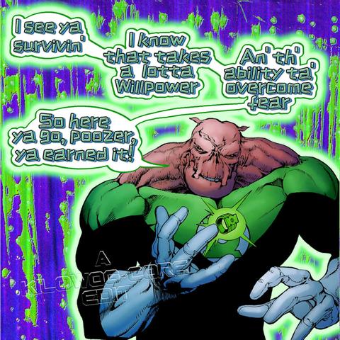 In a comic panel Kilowog has a Green Lantern ring hovering above his hand. He says, "I see ya' survivin'. I know that takes a lotta willpower. An' th' ability ta' overcome fear. So here ya go, poozer, ya earned it!" A caption reads "A Kilowog-core Edit".