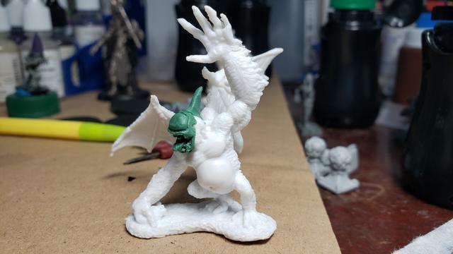 Reaper ape demon #77260 with the face cut off and a giant single eye and mouth sculpted over it. A greenstuff horn is on the top of it's head