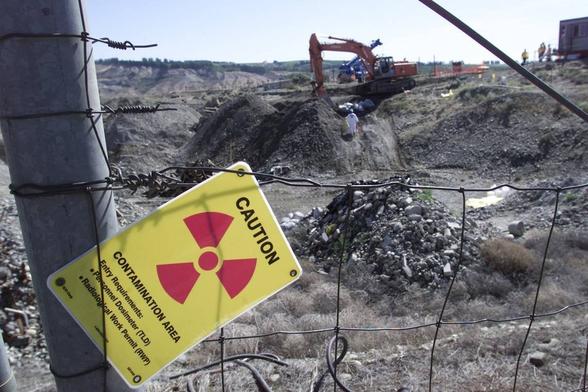 Drums containing shavings of depleted uranium discovered in a waste burial area at the Hanford nuclear site are dug up. Tri-City Herald file