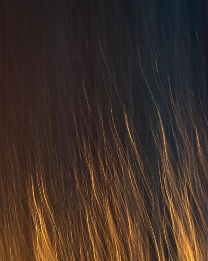 Orange lines on dark blue background, going upwards like flames