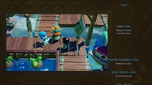 The first screen of credits, showing a picture of a coastal village
