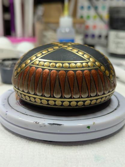 The band has been finished with antique bronze swooshes to complement the copper ones. The arms of the triquetra dot on top still haven't been filled.