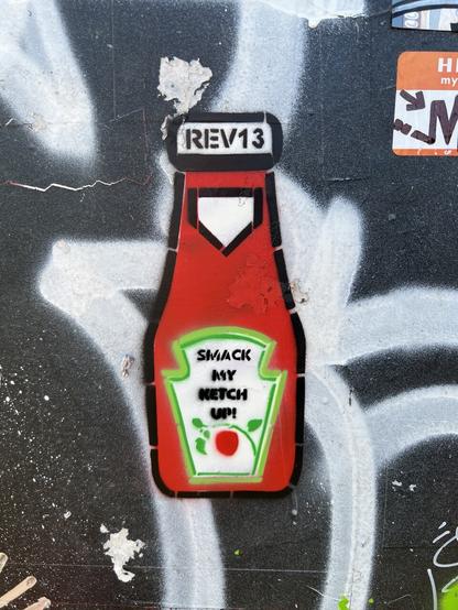 Stencil graffiti of Heinz ketchup bottle with text ‘Smack My Ketch Up!’