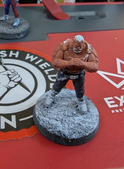 Heavily muscled cyberpunk dude from Unit 9 miniatures. Slacks and flesh base coated.