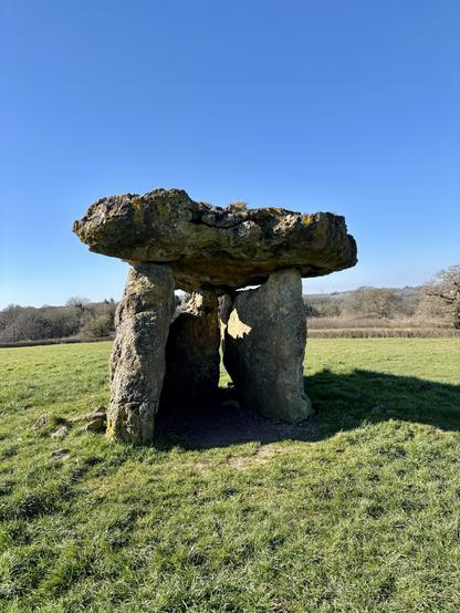 St Lythans burial chamber with a clear blue sky as a backdrop