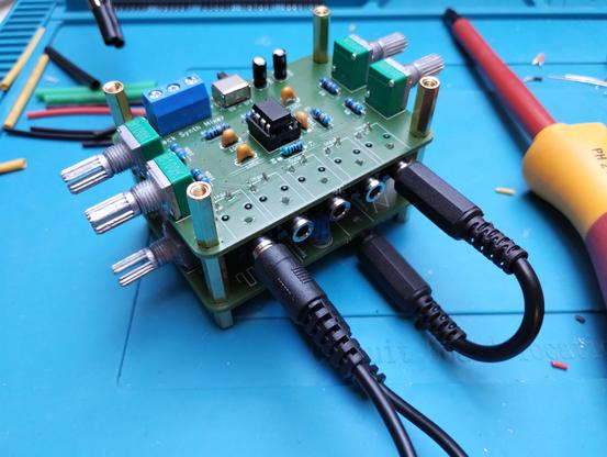 both modules stacked above each other and audio cables plugged in, connecting them