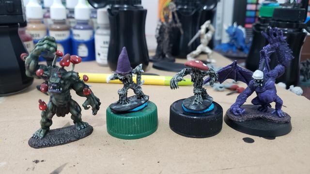 4 minis in a row. A troll infected with mushrooms, 2 mushroom folk, and a one eyed one horned flying purple people eater