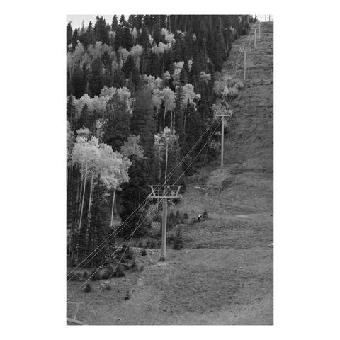 off season view of ski slope and lift without snow