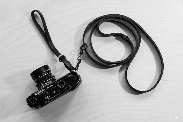 Rangefinder camera with DIY leather straps.