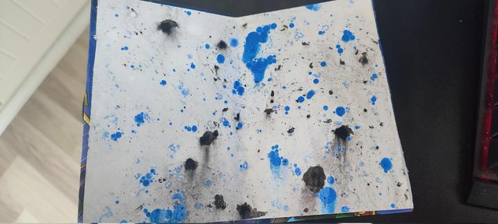 endpaper, marbled paper mostly blue and black dots.