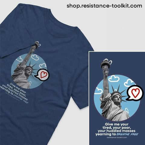 Illustration of the Statue of Liberty with a modern graphic design twist. The background features a blue circle with white cartoon-style clouds and small birds. A speech bubble with a red heart inside is placed near the statue. Below, a quote from Emma Lazarus's poem reads: 'Give me your tired, your poor, your huddled masses yearning to breathe free,' with 'breathe free' italicized in a handwritten-style font. The website 'resistance-toolkit.com' is displayed at the bottom.