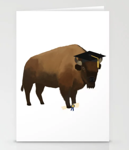 Our bison mascot (or buffalo mascot) is shown graduating!  The bison is wearing a graduation cap and holding a diploma.