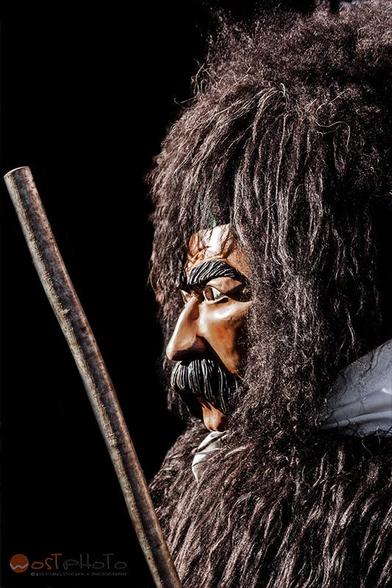 The typical Carnival mask of Sappada in Italy's Friuli, the Rollate, consists of a handmade wooden face mask with a mustache, a fur coat a belt with copper bells, and a broom.