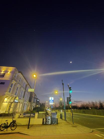 Seven Sisters Road, near the Park, with Jupiter, the Moon, and Venus in the sky
