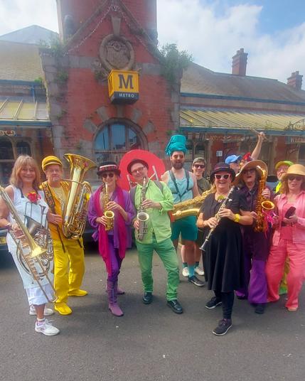 Brass players of the Storytellers streetband from Newcastle