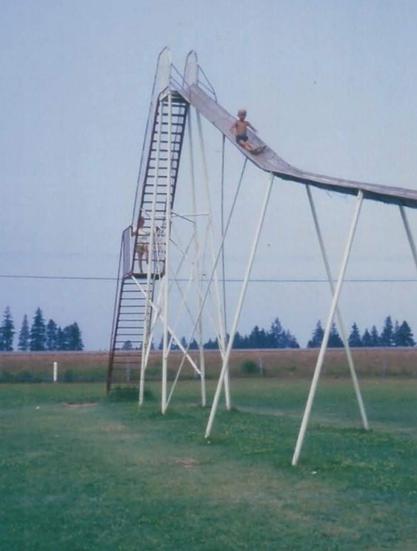 A playground from the 1970s—where slides were sky-high, safety was optional, and bravery was mandatory.
