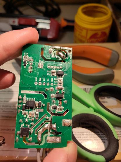 A circuit board with an ugly cut on one of the traces