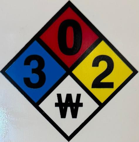A chemical hazard safety square is exactly centered in the image with the four points hitting the four edges. The left blue health hazard is 3; the top red fire hazard is 0; the right yellow reactivity hazard is 2; the bottom white specific hazard contains a striked through W.