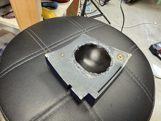 The back of the radar eye after fitting the blacked out lens from from the back with hot glue.