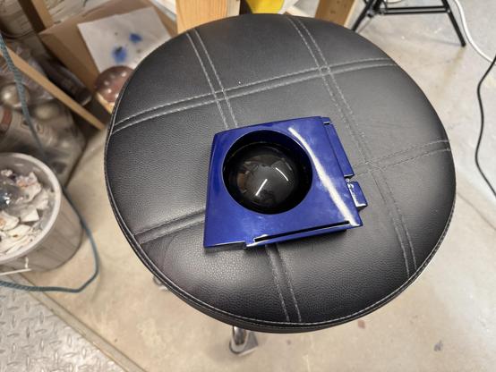 The front of the finished radar eye on a black faux-leather stool ready to be installed on the dome.