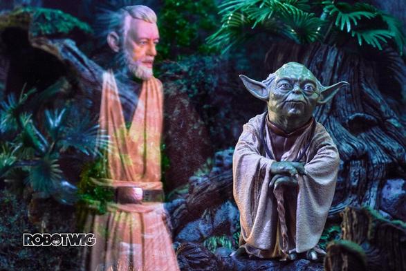 Obi wan in ghost form talks to Yoda who's sat on a tree stump