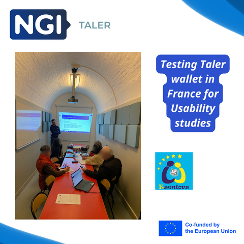 Senior citizens seated at a table in a room, participating in a usability test for the NGI Taler wallet. A representative from the civil society group 'E-Seniors' is presenting the wallet's features to the group