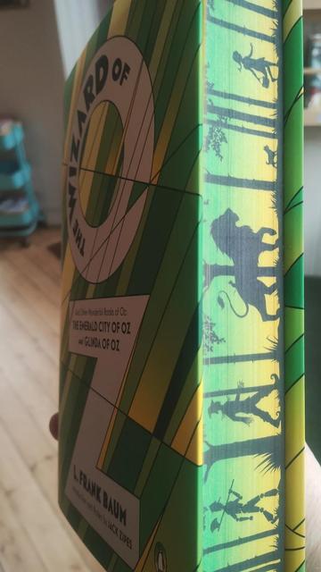 front and side view of the special Wizard of Oz hardback, showing the painted edges (spredges)