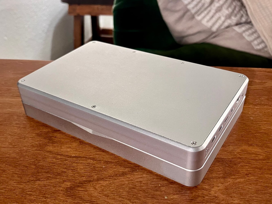 a closed silver mnt pocket reform on a table