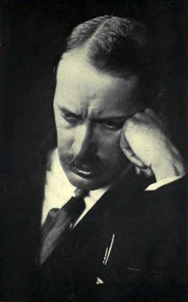 Black and white portrait photography of Mihály Károlyi  looking pensive  as rests his head against his left hand.