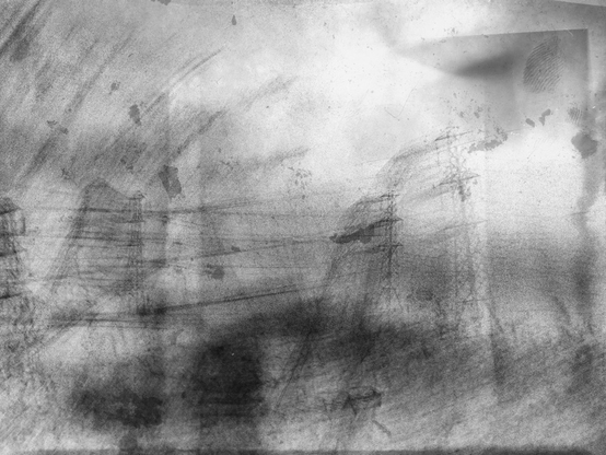 Black-and-white intentional camera movement very abstract image of pylons and sky