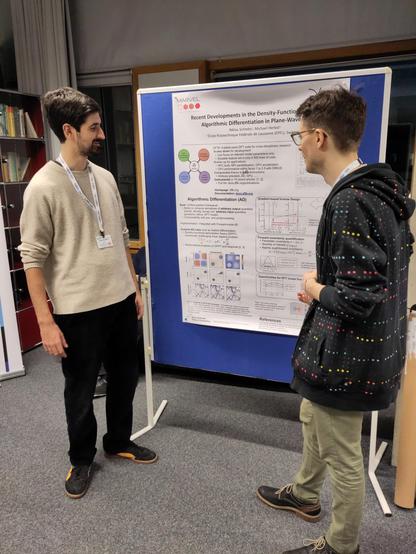 Niklas Schmitz (left) explaining his recent research results