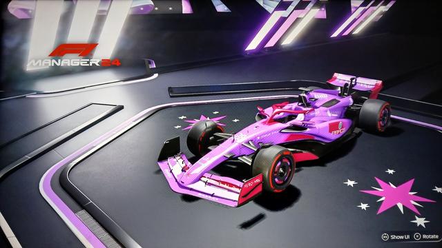 Screenshot of a Formula 1 car in a showroom in F1 Manager 24. The car has a custom livery with a purple color scheme inspired by Twilight Sparkle from My Little Pony: Friendship is Magic. The team logo on the floor of the showroom is Twilight Sparkle's cutie mark: a six-pointed reddish purple star with an offset white star behind it. Small white stars surround the large one in the center.