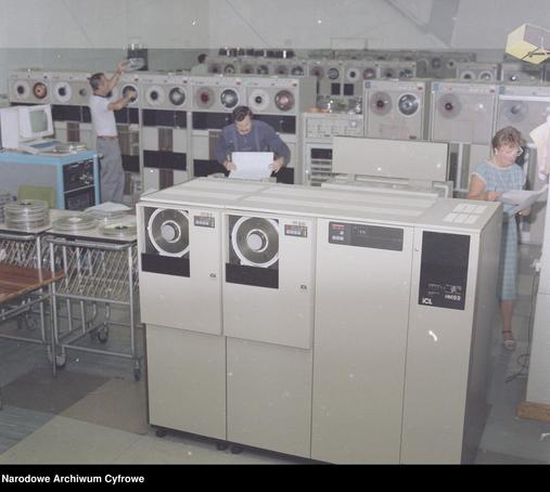 Central Mining Computing Center in Katowice
Magnetic memory stations of the #ICL company. In the background a computer with a monitor.
Archive: National Digital Archive
Complex: Lech Zielaskowski's photographic archive
Signature: 3/53/0/3/305
Dates: 1985 - 1990
Upload: Sikorski Arkadiusz https://arq.pl/