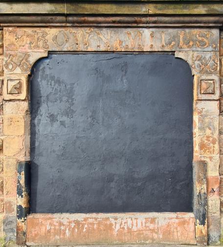 An boarded up entrance to a former flour mill in Glasgow.