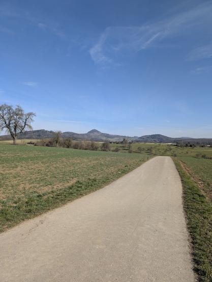 Clear, blue sky and the Hohenstaufen towers the forest in the distance