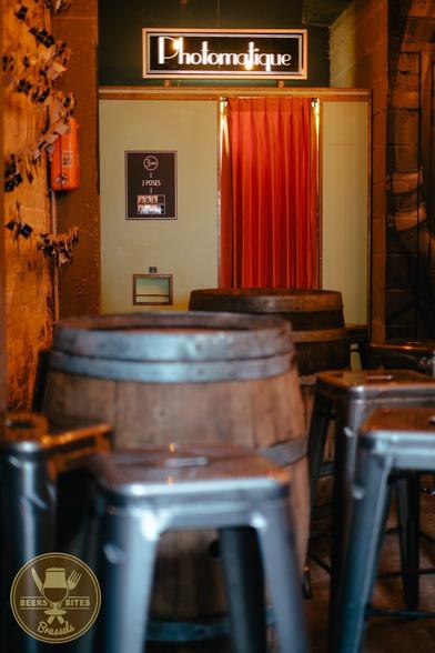 a photobooth and a barrel with chairs