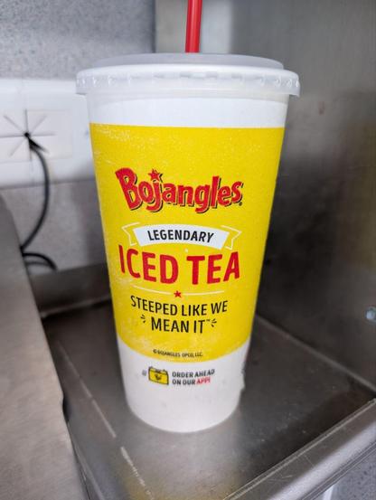 A takeout cup of bojangle's legendary iced tea. Steeped like we mean it.