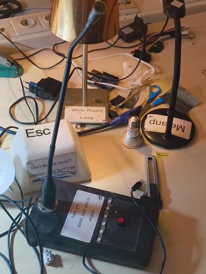 A relatively clean desk with labeled devices.
